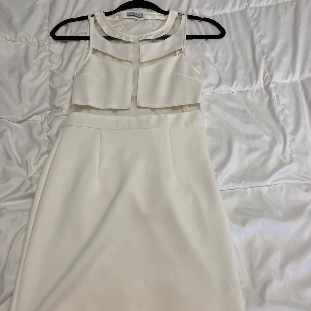 White sleeveless dress.